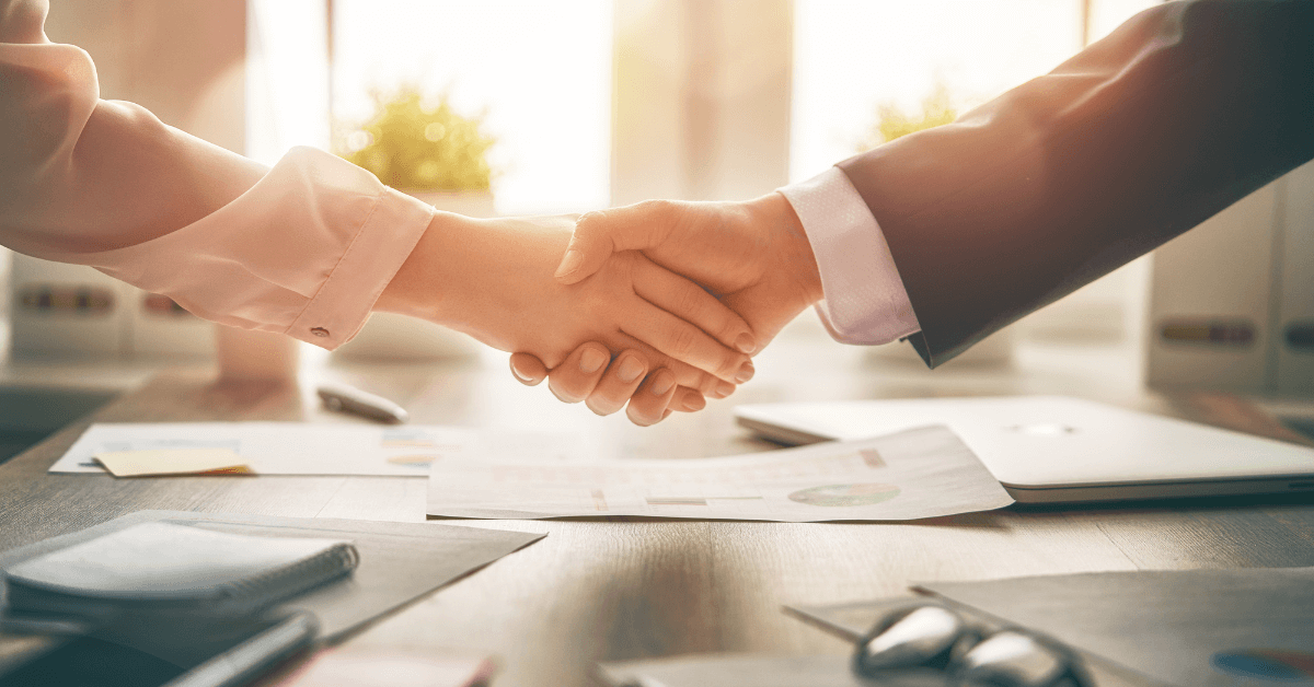 parties shaking hand resolving a real estate dispute